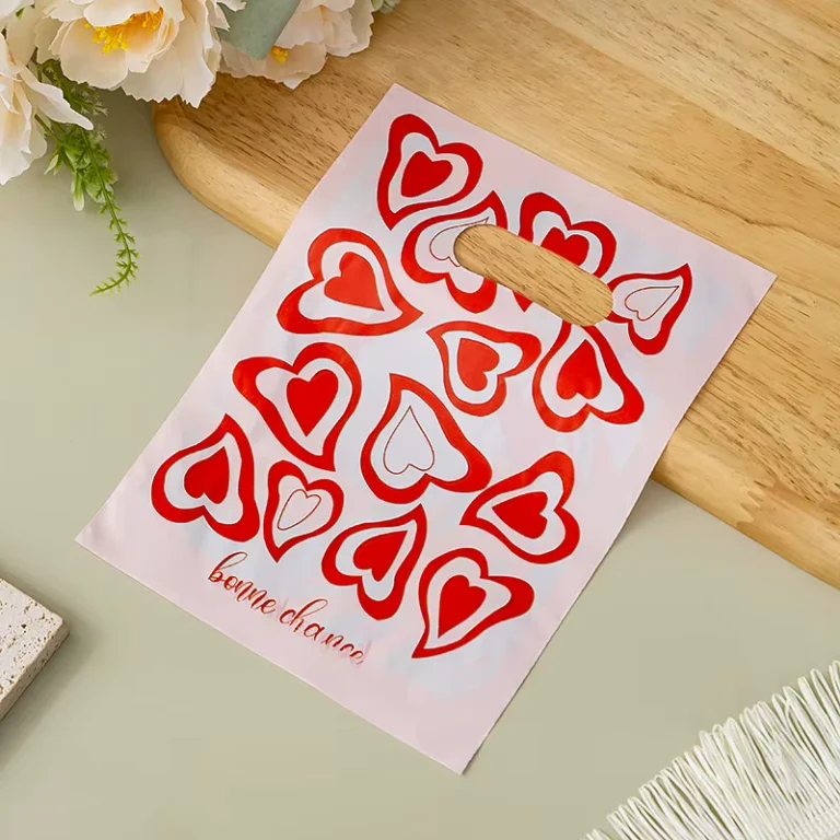 Pink-Red-Heart-Print-Plastic-Merchandise-Bags-Bonne-Chance-Die-Cut-Handle-Bags-for-Retail-and-Boutique-Stores