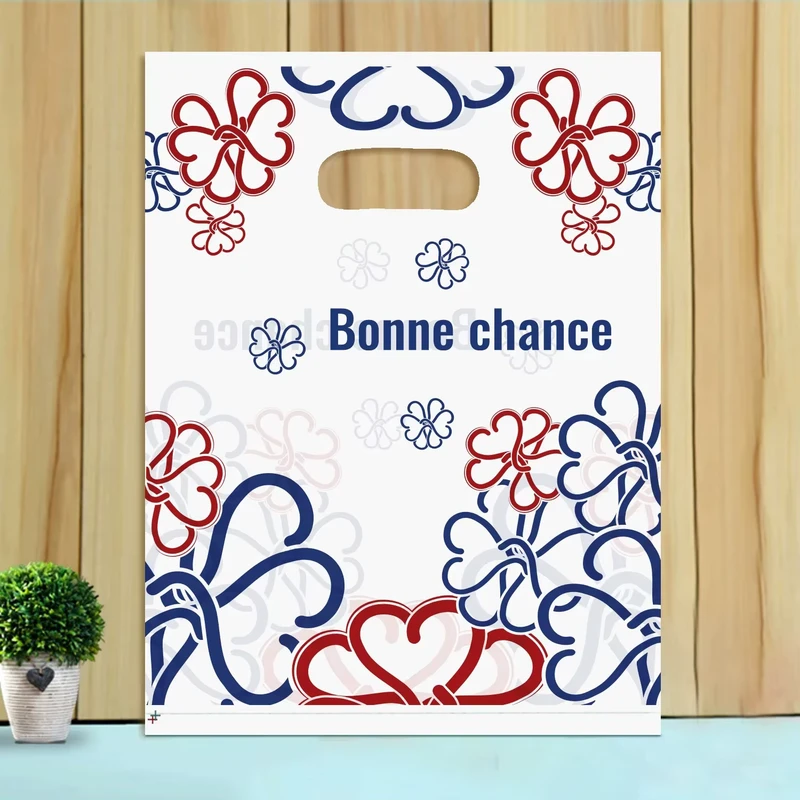 White Reusable Shopping Bag with Red Blue Floral Pattern and Bonne Chance Text for Gift or Party Use